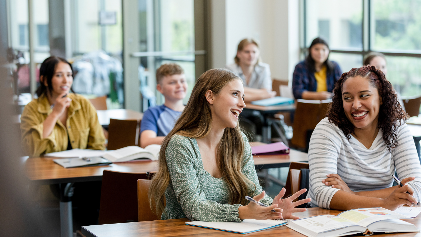 Diverse students in classroom having a discussion representing the cultural mismatch theory