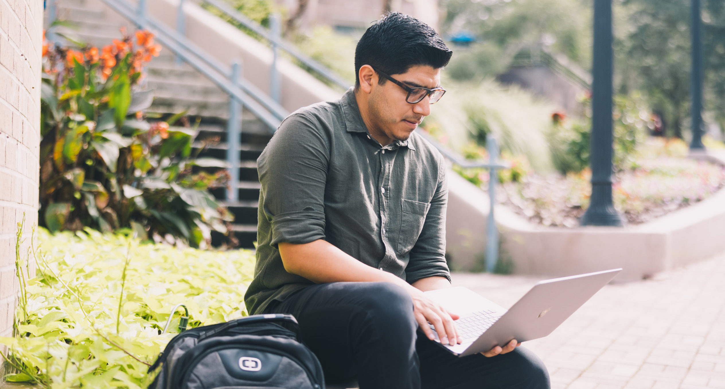 Student on laptop outside