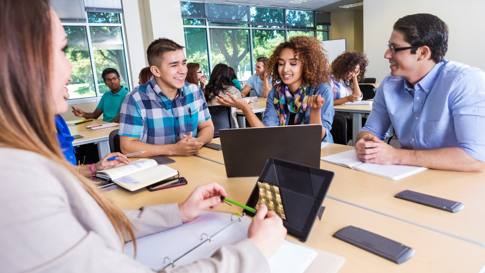 Students in class discussing impactful teaching strategies