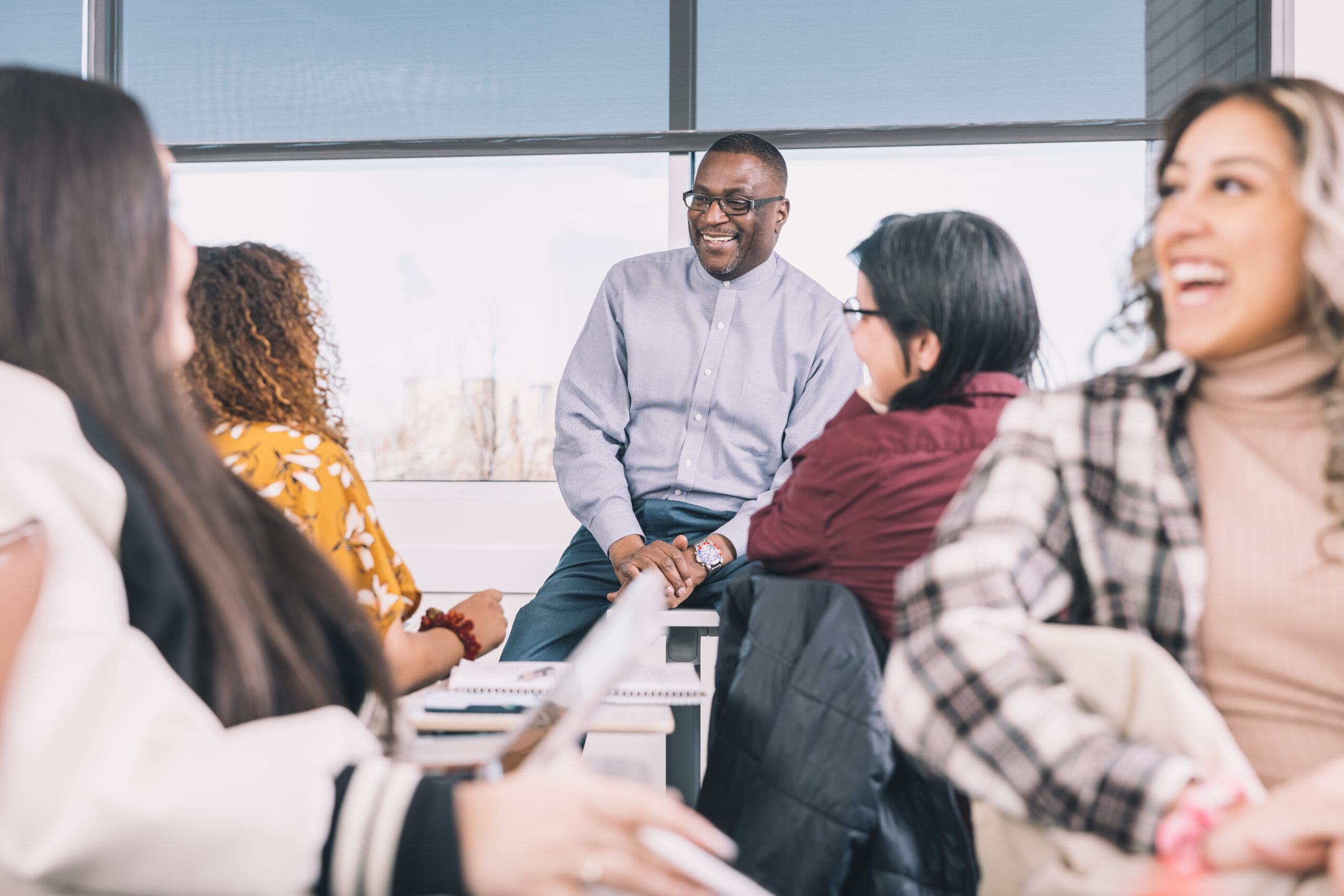 professor in class with students using equity-minded teaching