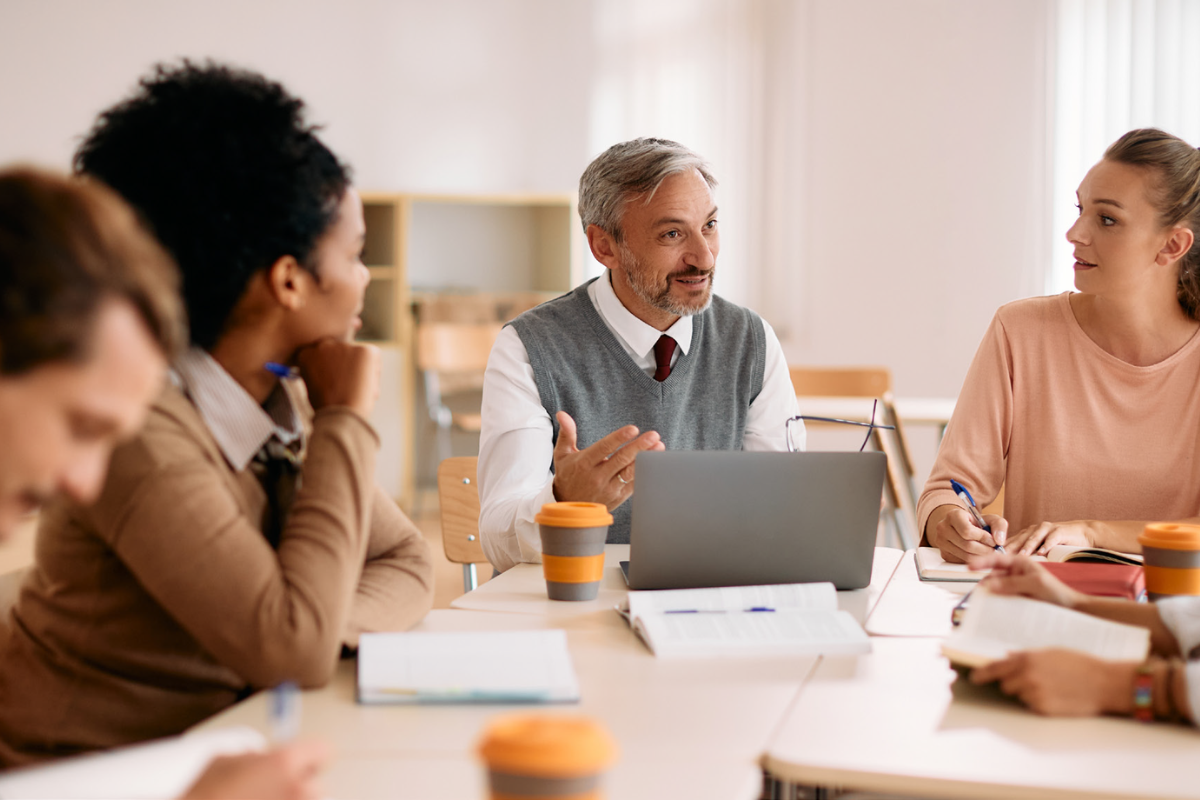 group of faculty in meeting for generative AI faculty development