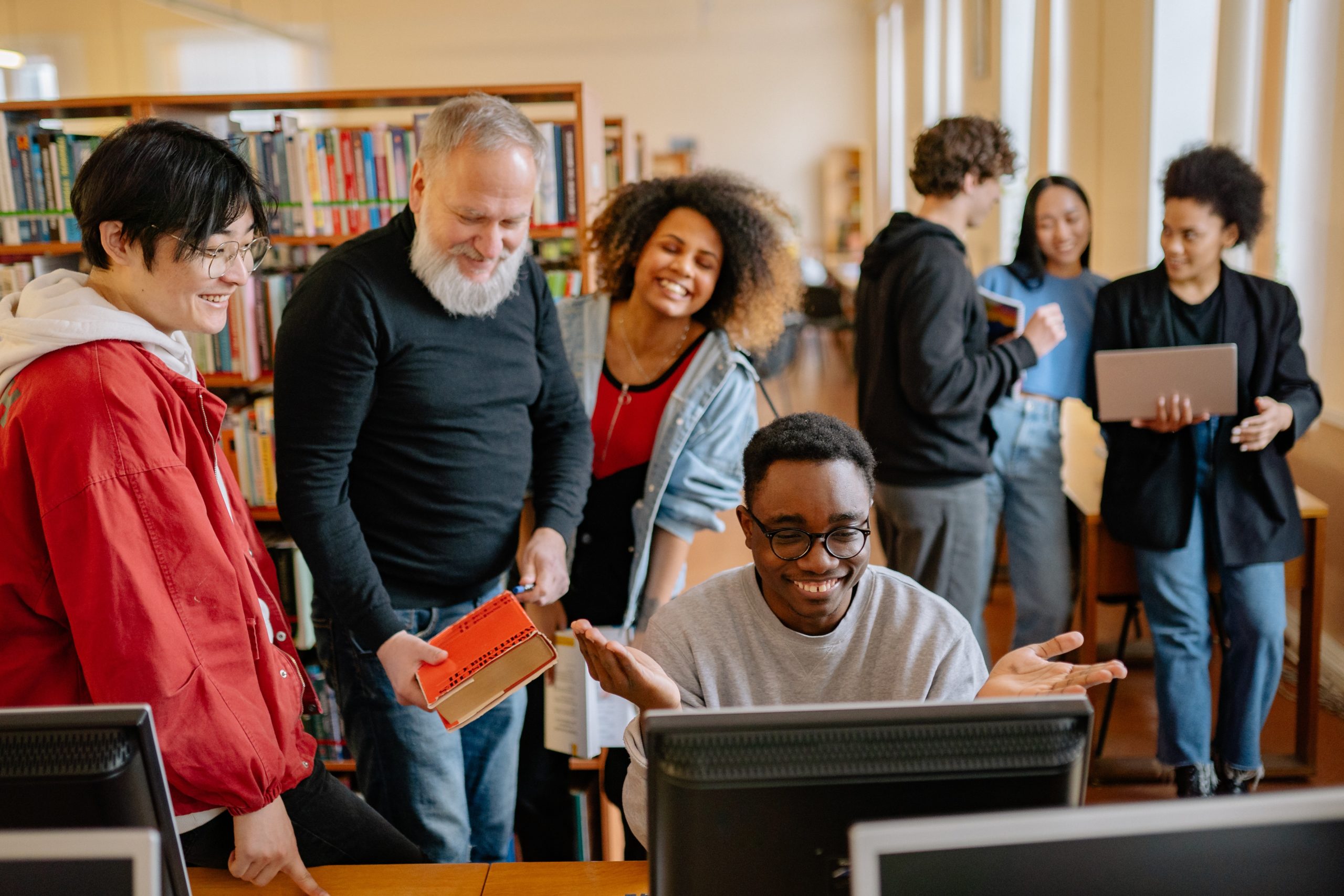 group of students and professor displaying social-emotional learning